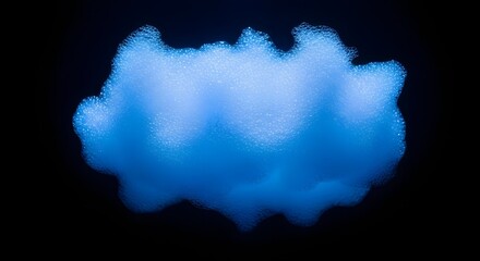 Obraz premium A cloud of blue foam bubbles against a dark background space