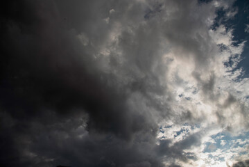 Dramatic dark storm thundercloud rain clouds on black sky background. Dark thunderstorm clouds...