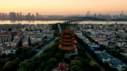 Breathtaking aerial view of Yellow Crane Tower in Wuhan at sunset with stunning cityscape backdrop