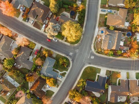 Aerial view of a residential neighborhood in Santa Clara, California, USA, showcasing houses, streets, and trees during the day. The photo highlights suburban living.