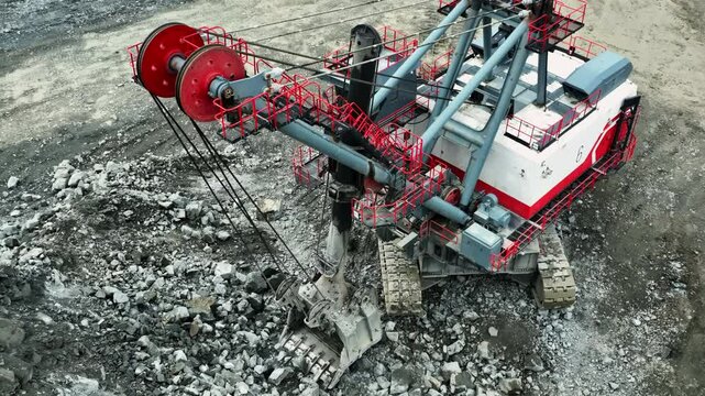 Giant excavator gathering rocks in a quarry. Stock clip