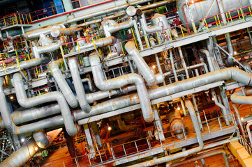 Industrial piping system in a manufacturing facility showcasing complex layout and extensive...
