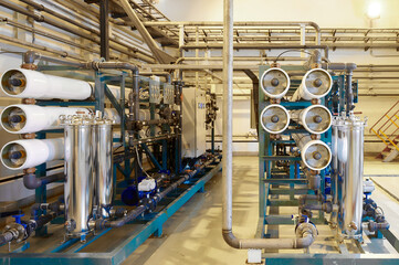 Modern industrial reverse osmosis water purification system operates within a clean technical facility environment