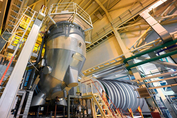 Flue gas duct system located in an industrial facility focusing on energy efficiency and emissions...