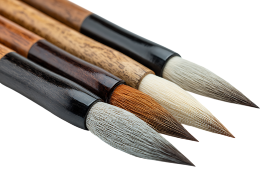 Close up of four Chinese calligraphy brushes.