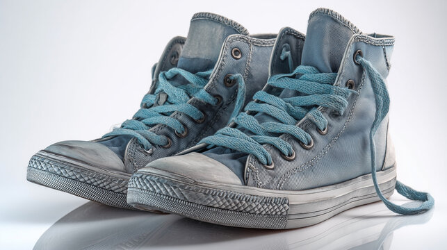 Two blue Converse sneakers with laces