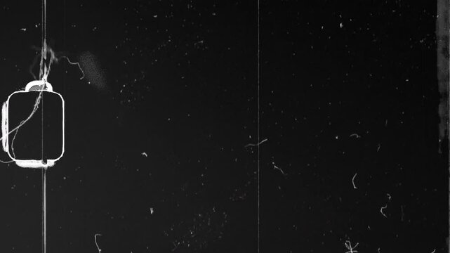 Genuine 16mm grain film with analog overlay effects including dust and scratches on the film designed to support storytelling and film editing projects.
