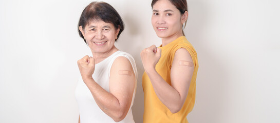 Adult and Elderly Woman with bandage after received vaccine. Vaccination and Immunization for...