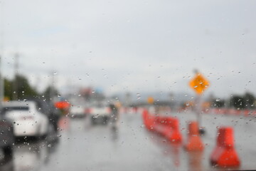 car on highway road with rainny season, blurred image