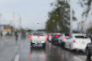 car on highway road with rainny season, blurred image
