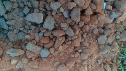 A collection of small gravel stones commonly used for construction, landscaping, or as a base layer in roads and pathways. These pebbles vary in size and color, offering a natural and durable surface.