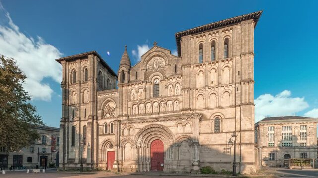 Eglise Abbatiale Sainte-Croix timelapse hyperlapse in Bordeaux, France, Romanesque Catholic church with a medieval facade. Landmark showcases rich architectural and cultural heritage under a blue sky