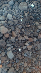 A collection of small gravel stones commonly used for construction, landscaping, or as a base layer in roads and pathways. These pebbles vary in size and color, offering a natural and durable surface.