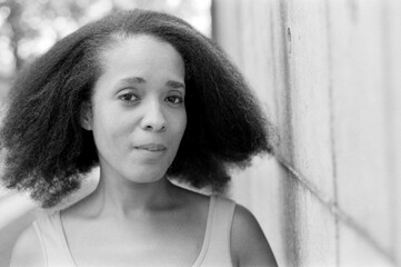 Portrait of confident afro-american woman with analog film grain