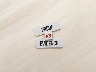 wooden tag with the words Proof vs Evidence. The key difference lies in the level of certainty or...