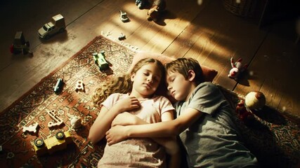 Sweet slumber: A boy and girl sleeping peacefully among toys on a rug - Powered by Adobe