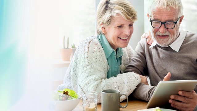 Senior couple using a tablet remix