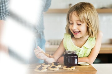 Little caucasian girl baking cookies