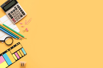 A Vibrant Collection of Colorful Office Supplies Displayed on a Bright Yellow Background