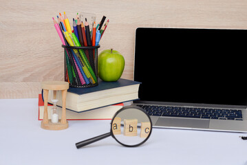Study Essentials for Success Including Laptop, Books, and Various Supplies for Effective Learning