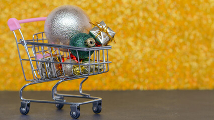 A delightful Shopping Cart filled with various vibrant and colorful Christmas Ornaments