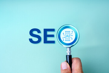 SEO optimization, search engine marketing, with Artificial intelligence assistant tools technology concept. AI chip focused in magnifying glass lens in people hand, with text SEO, on blue background.
