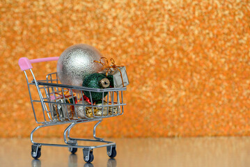A Shopping Cart Filled to the Brim with Colorful and Festive Christmas Ornaments