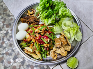 Somtam Platter is a popular food menu that combines spicy vegetable salad with meat for protein. It is a food that reflects the lifestyle and culture of the people of Northeastern Thailand.