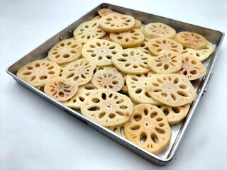 A favorite dessert of the East, lotus roots that have been washed, peeled and thinly sliced are...