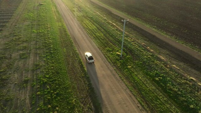 Drone footage following a white ute driving along an unsealed road near Moree in New South Wales, Australia.