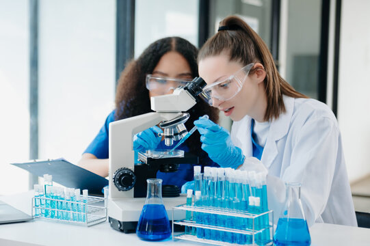 Scientist two woman with tablet and laptop, laboratory and ecofriendly science. Agriculture, research and scientists with online reading, test samples
