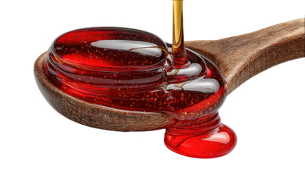 Golden Pour: Captivating moment of golden syrup cascading from a wooden spoon, symbolizing the richness and natural sweetness of a culinary delight. 