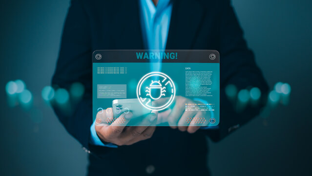 Cybersecurity, data breaches, technology risk, digital protection, privacy, hacking, and cyberattack prevention. Businessman holding a smartphone with a futuristic holographic warning and bug icon.