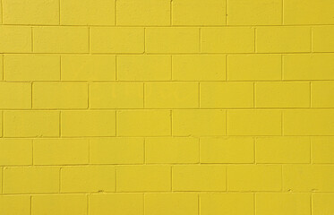 Yellow brick wall close-up abstract textured background