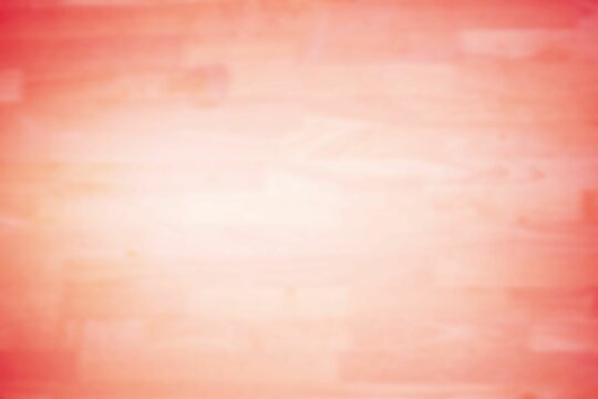 Fototapeta Displaying gradient transitioning coral pink to soft peach on subtle wood grain painted wood panel