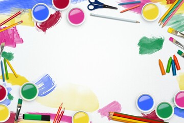 Obraz premium Flat design blank sheet is sitting on desk surrounded by bright paint jars, brushes, copy space