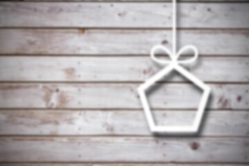 Obraz premium Blurred christmas decorations on wood
