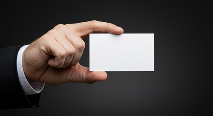 Fototapeta premium Businessman holds a blank card for mockup identity in studio
