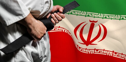 Midsection of martial artist against Iranian flag © vectorfusionart