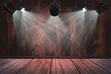 Spotlights against wooden wall