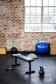 Fototapeta Gym equipment in fitness studio
