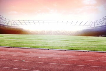 Red rubber running track and green field are appearing in flat design stadium under sunrise sky