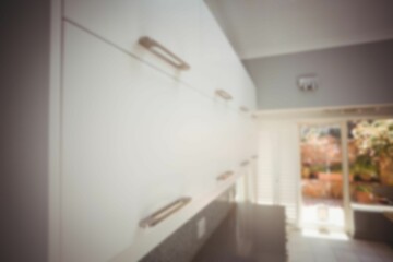 Defocused image of cabinets in kitchen