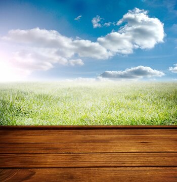 Fototapeta Wooden planks against field