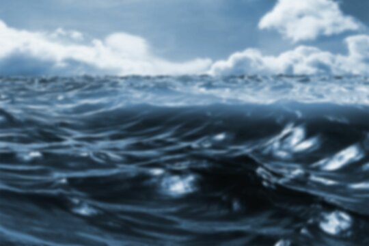 Fototapeta Ocean waves are rolling across dark blue flat design surface under heavy overcast clouds