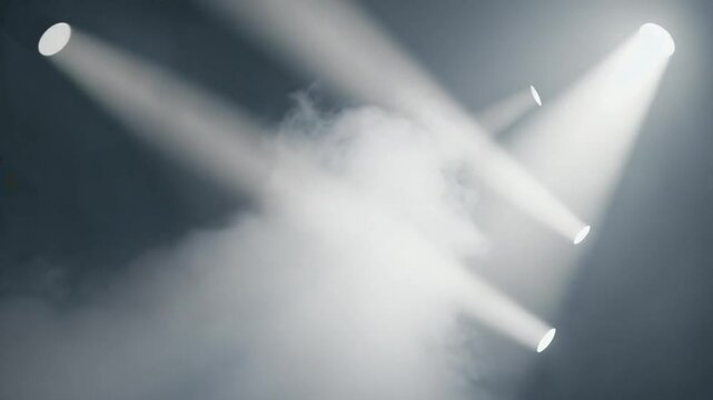 Dramatic volumetric light beams cutting through a dark, smoky space, creating a mysterious and atmospheric effect. Ideal for abstract, stage, or cinematic themes.