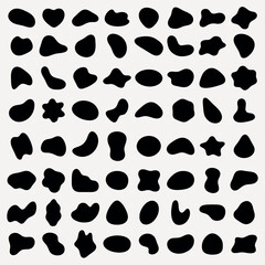 Fototapeta premium Abstract black shapes on a white background. Organic, irregular forms. Various blob-like, fluid shapes. Artistic, abstract design with unique shapes. Black shape vector set.