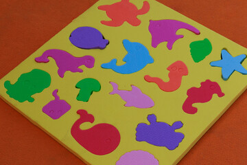 Animal shape template for toddlers and kids on playground isolated on orange background.