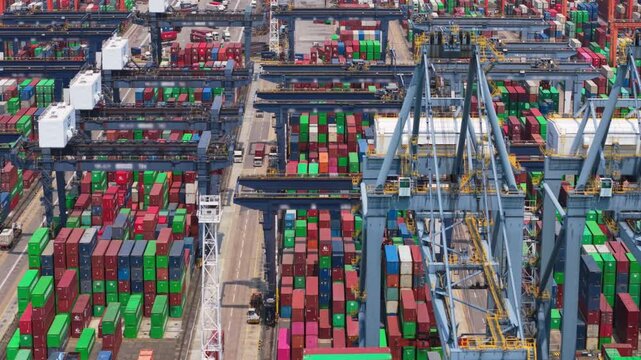 Modern container terminal managing logistics and freight transportation in hong kong, showcasing import and export operations within a dynamic global trade environment. Trade wars, tariffs - Powered by Adobe