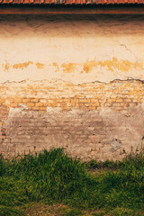 Old wall with flaking paint layers as grunge background